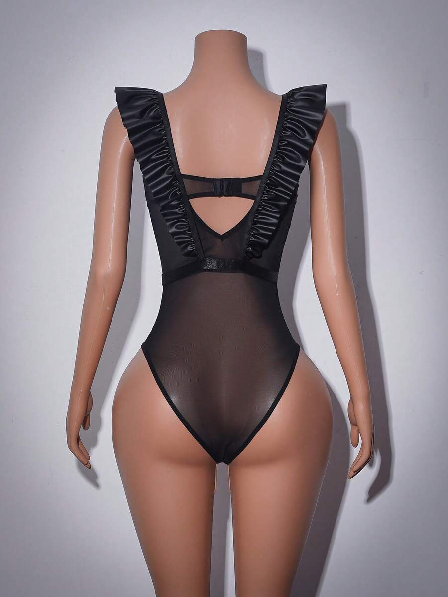 Women's black sheer teddy lingerie with ruffle trim and adjustable spaghetti straps.