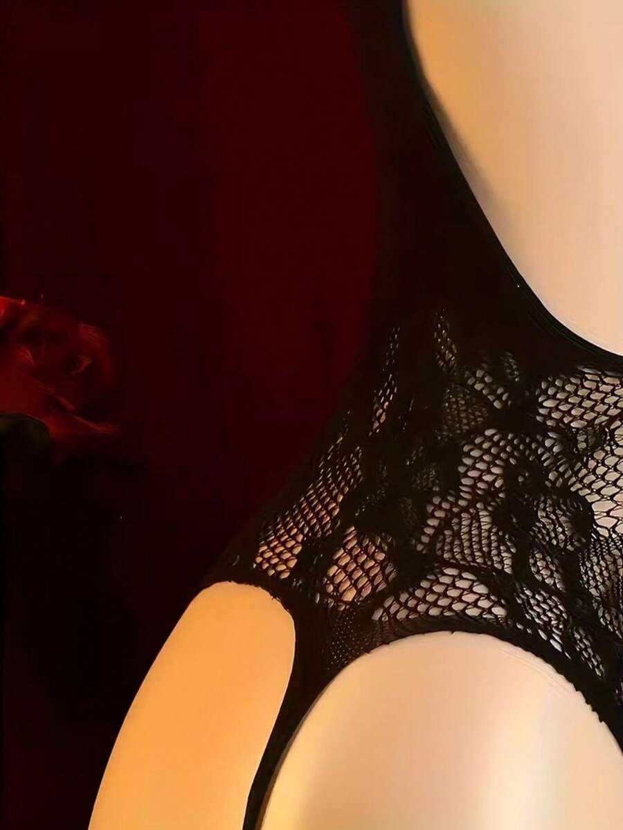 Black sheer hollow mesh body stocking jumpsuit with cut-out details, sleeveless spaghetti straps, and high stretch fabric.