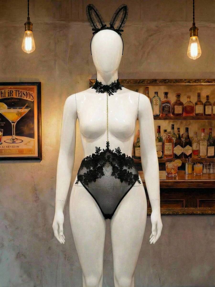 Black sheer halter backless lingerie bodysuit and matching bunny ear headwear for plus size women, featuring adjustable straps and tie-back detailing.