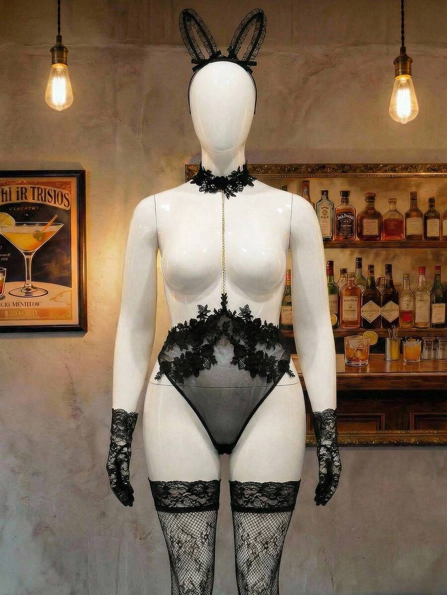 Black sheer halter backless lingerie bodysuit and matching bunny ear headwear for plus size women, featuring adjustable straps and tie-back detailing.