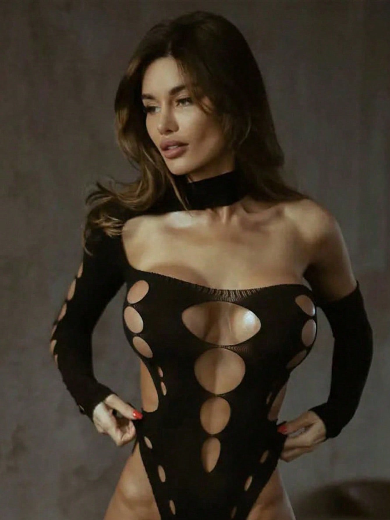 Women's sheer mesh lingerie bodysuit with hollow out detail, strapless neckline, sleeveless design, wireless construction, and medium stretch fabric.