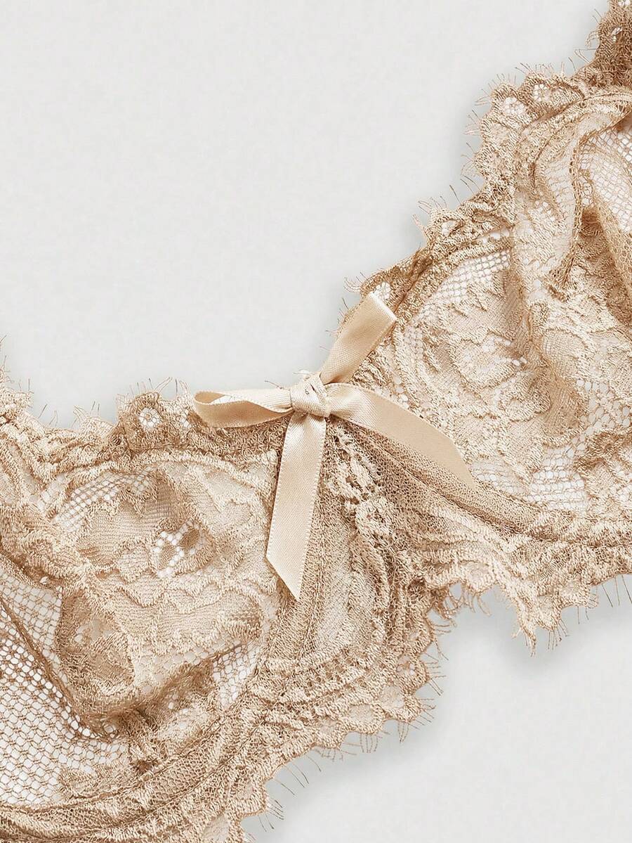 Black sheer floral lace plunge bra featuring underwire support, unlined triangle cups, adjustable straps, and a backless design for women.