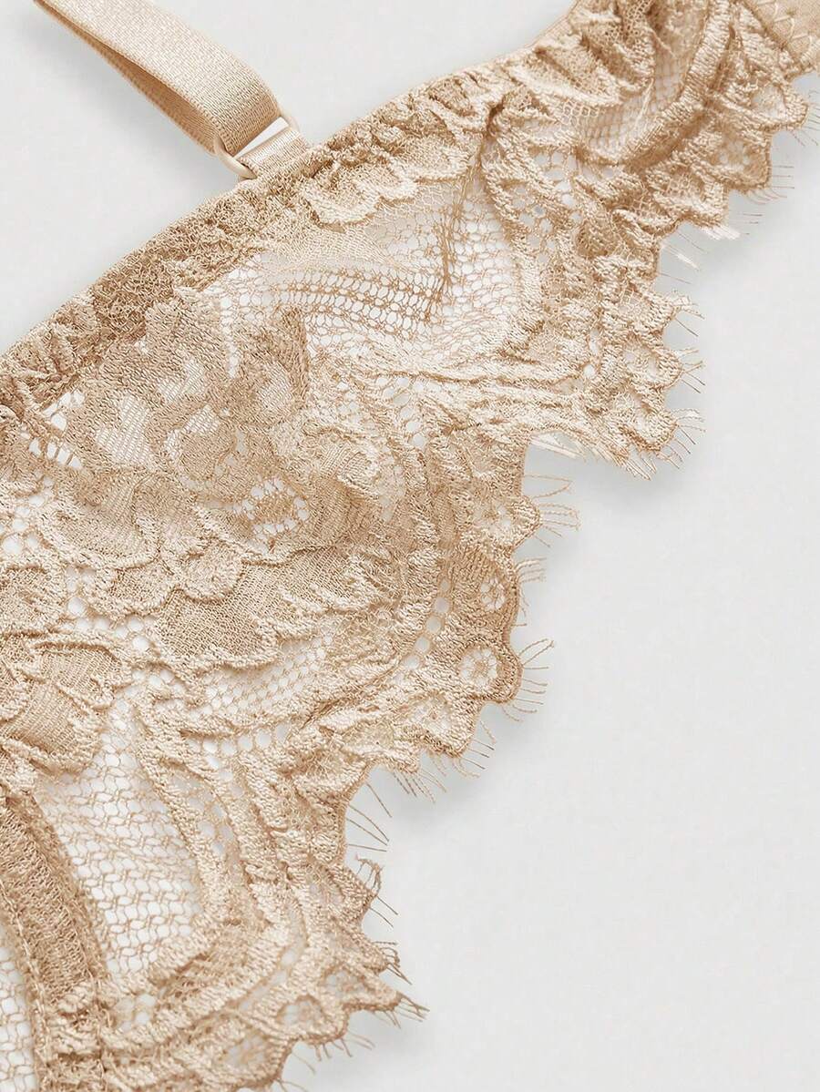 Black sheer floral lace plunge bra featuring underwire support, unlined triangle cups, adjustable straps, and a backless design for women.