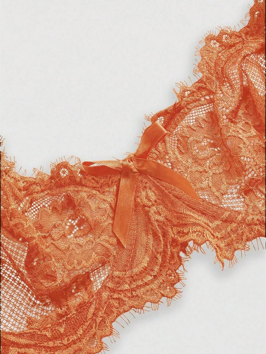 Black sheer floral lace plunge bra featuring underwire support, unlined triangle cups, adjustable straps, and a backless design for women.