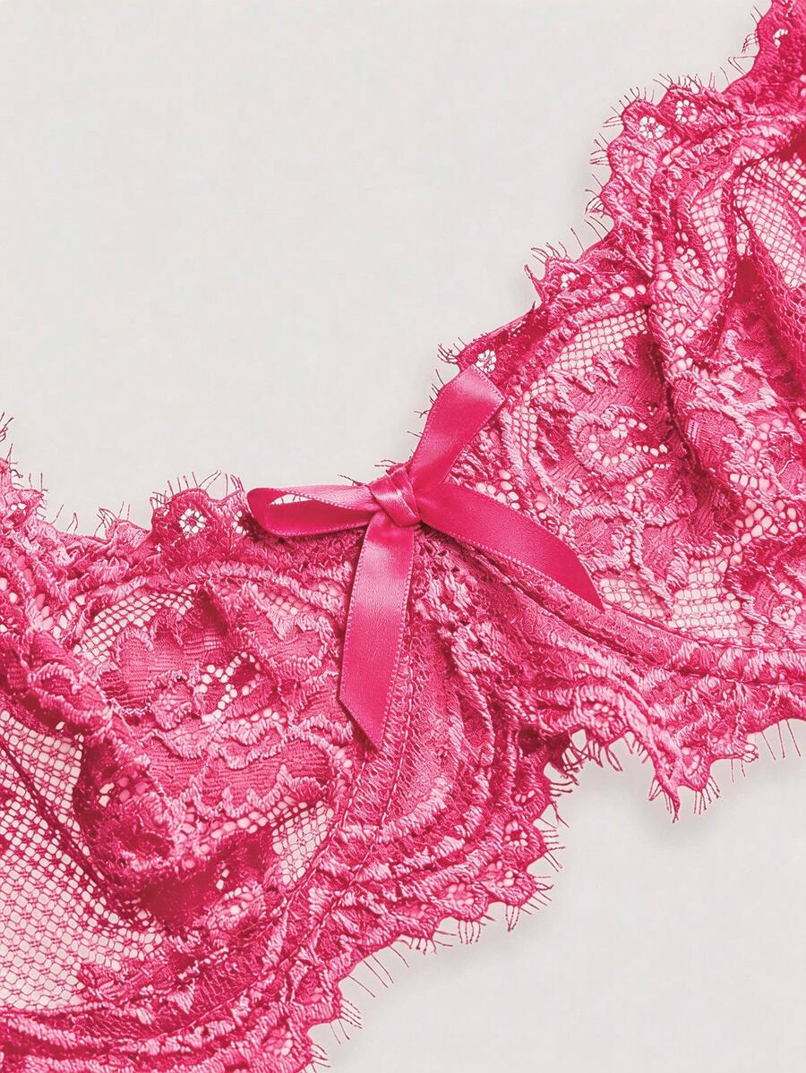 Black sheer floral lace plunge bra featuring underwire support, unlined triangle cups, adjustable straps, and a backless design for women.