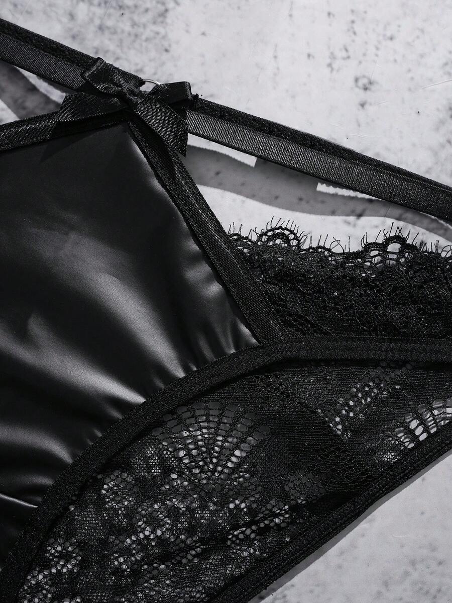 Black lace patchwork lingerie set featuring an underwire bra with adjustable straps, backless detail, and matching mid-rise briefs.