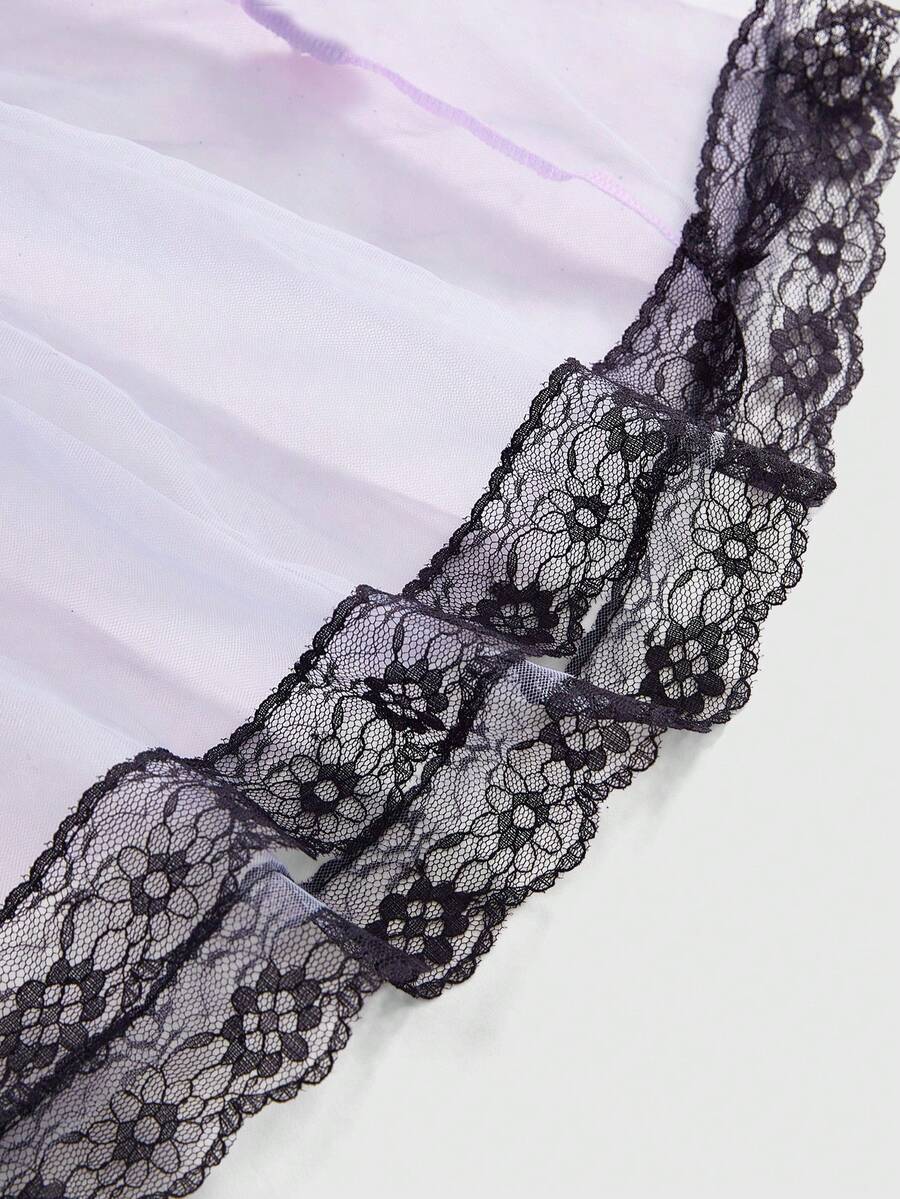 Black 7-piece Gothic bunny girl cosplay lingerie set featuring bunny ears headband, bowknot collar, mesh arm cuffs, criss-cross top, mini skirt, and thong panty