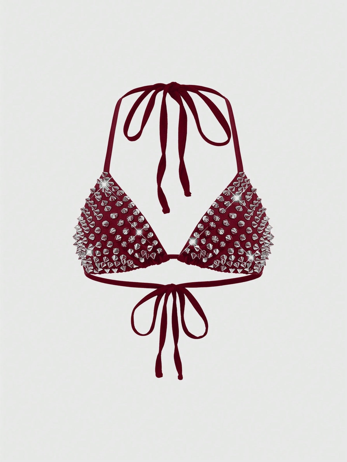 Women's black knitted halter micro crop top featuring studded details, high stretch fabric, and an asymmetrical hem.