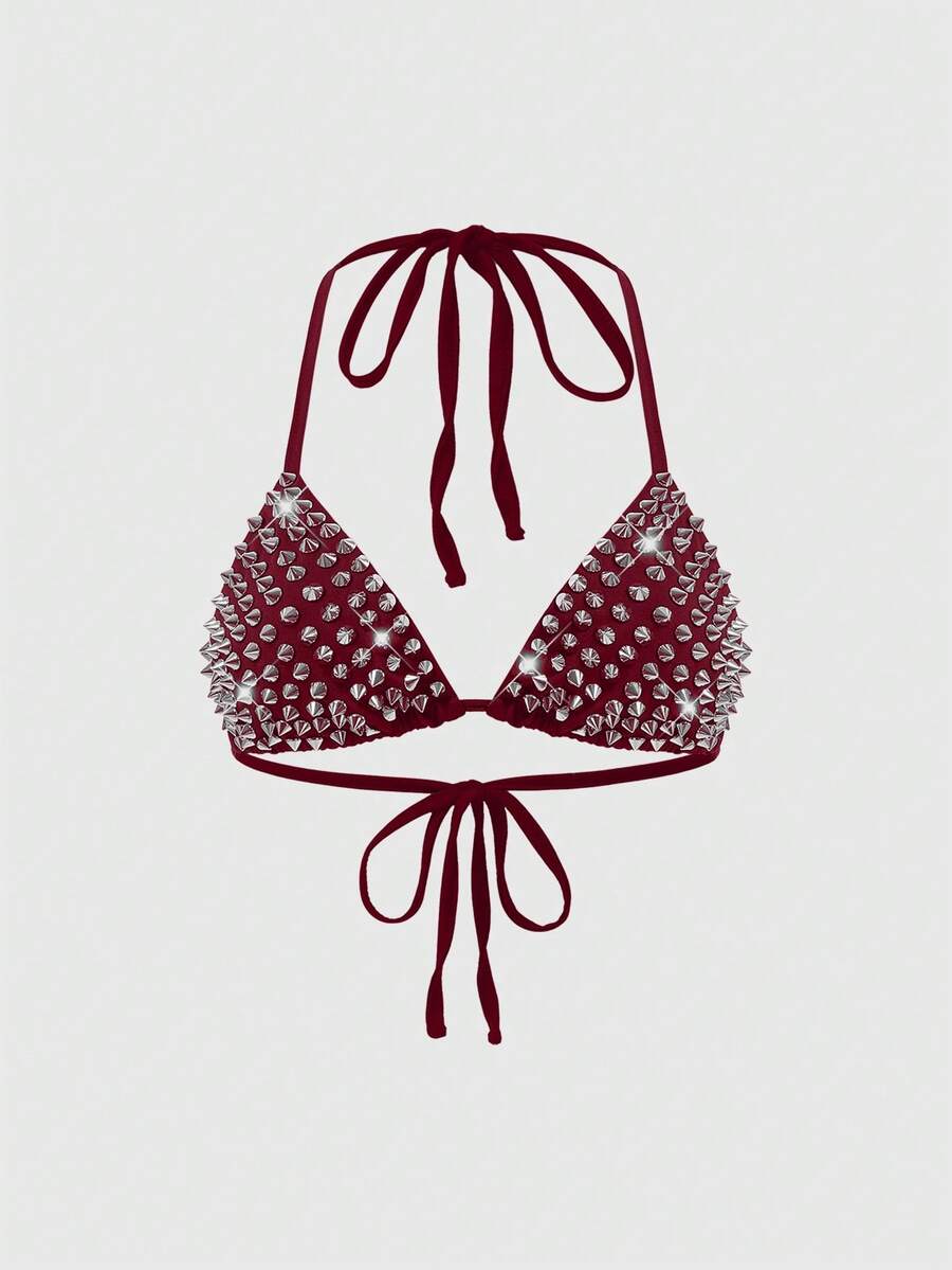 Women's black knitted halter micro crop top featuring studded details, high stretch fabric, and an asymmetrical hem.