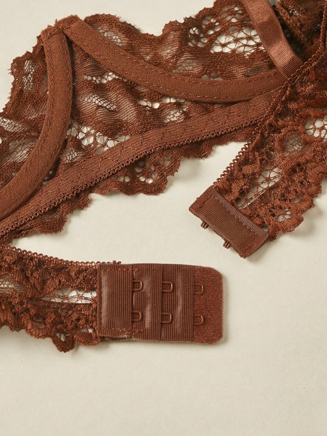 Women's sheer lace underwire bra and thong set with open cup bra, adjustable spaghetti straps, and matching low rise V-string thong in a 2-piece lingerie set.