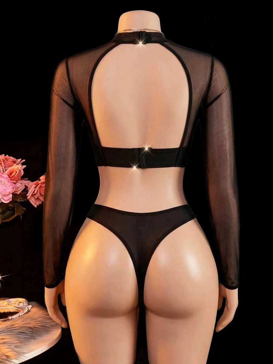 Black sheer cut out lingerie set including triangle cup underwire bralette with adjustable straps and low rise thong panty.
