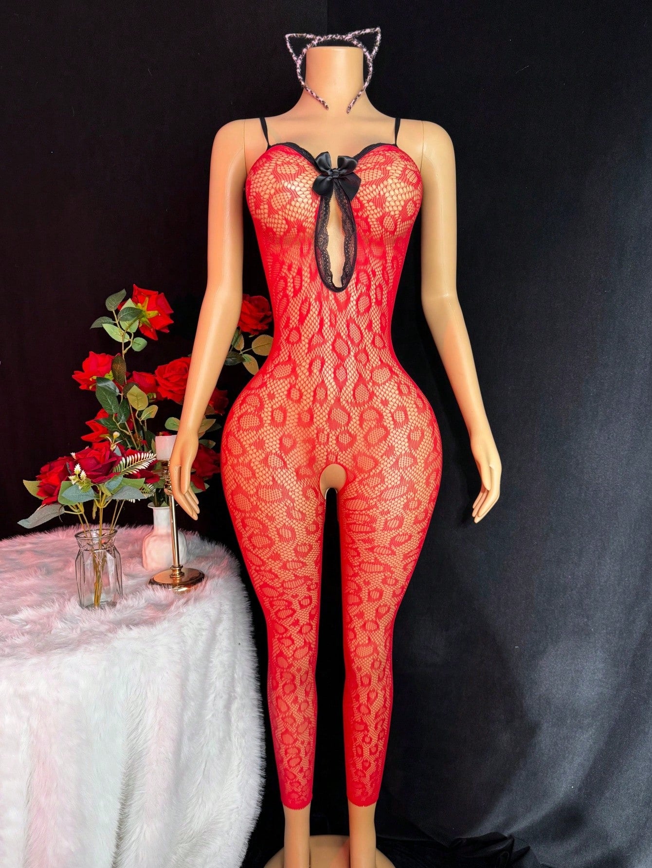 Sleeveless pink lingerie bodysuit 2 piece set with sheer textured fabric, backless design, contrast lace, knot detail, adjustable spaghetti straps, and cropped low rise fit.