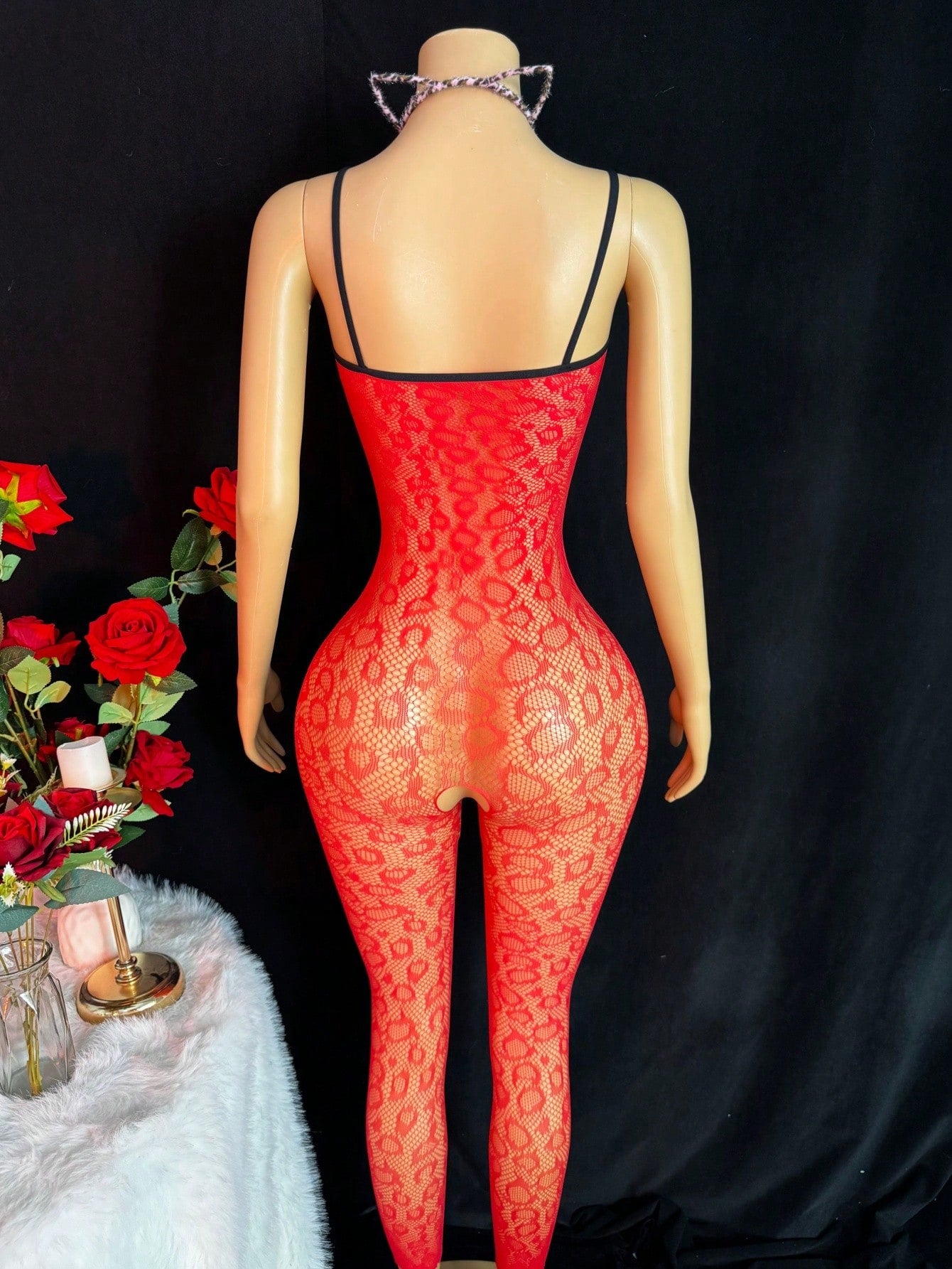 Sleeveless pink lingerie bodysuit 2 piece set with sheer textured fabric, backless design, contrast lace, knot detail, adjustable spaghetti straps, and cropped low rise fit.