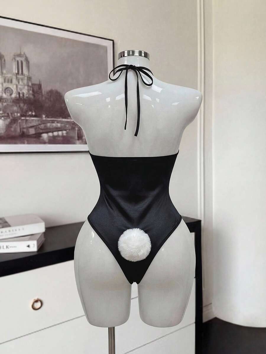 Front view of a black satin halter neck lingerie bodysuit featuring wireless support, sheer details, and adjustable straps.