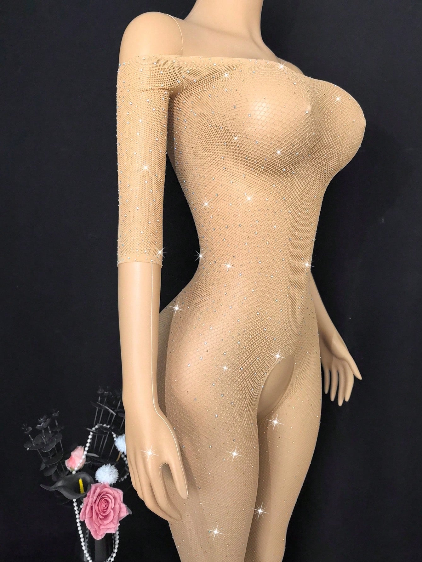 Women's apricot mesh lingerie jumpsuit with long sleeves, adjustable spaghetti straps, semi-sheer finish, and high-stretch fit.