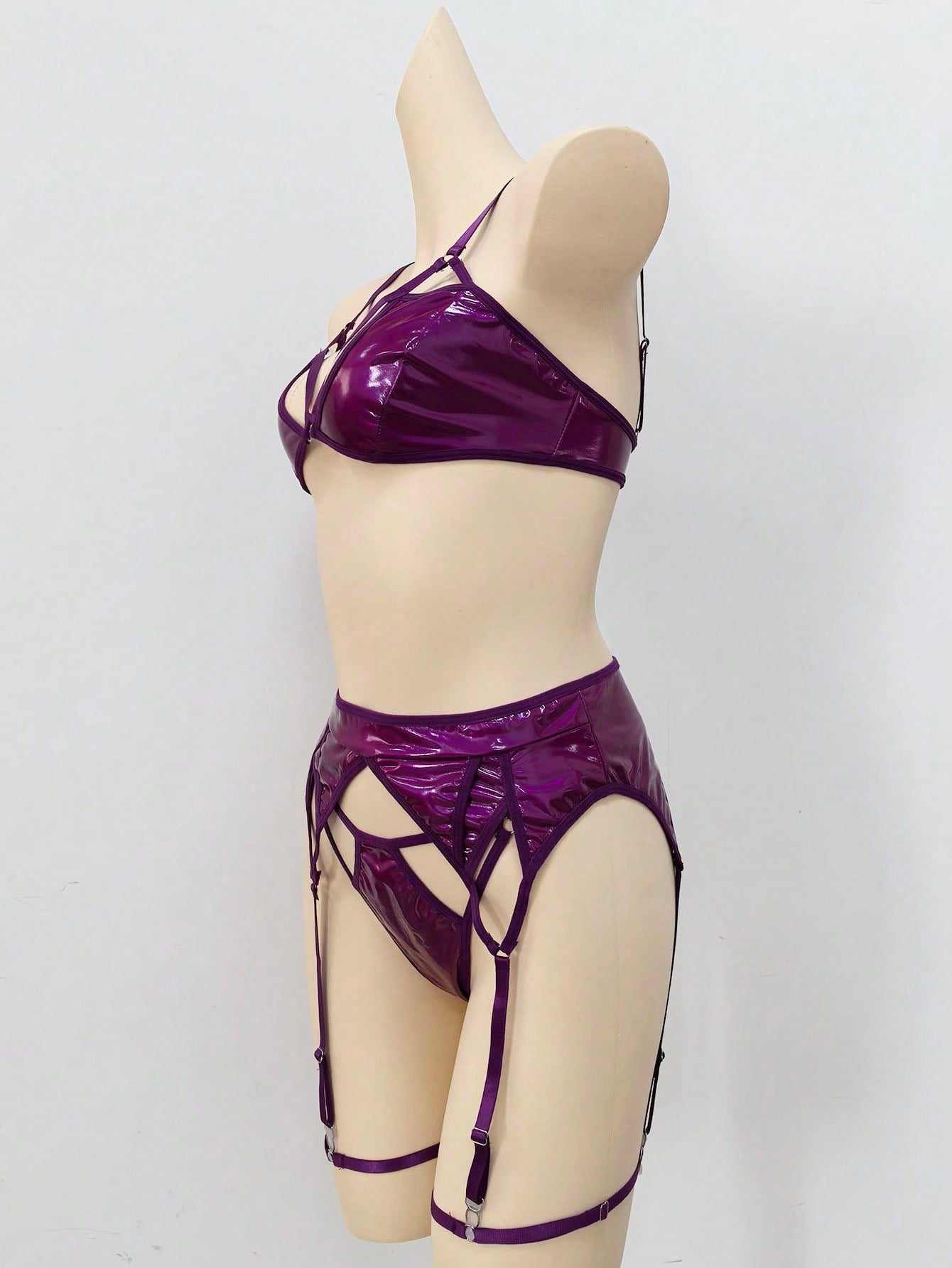 Women's 4-piece wireless lingerie set with cut-out bralette, adjustable spaghetti straps, V-string panty, and matching body accessories in plain style.