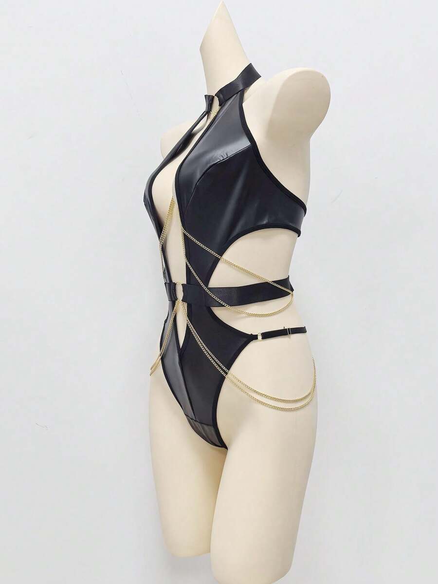 Front view of a women's black PU leather halter teddy bodysuit with cut-out details, metallic chain accents, and ring hardware.