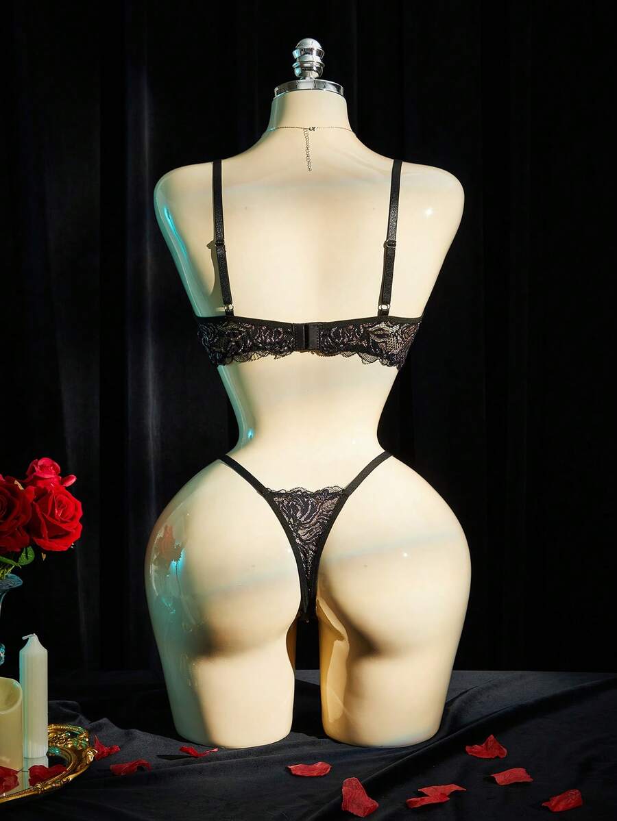 Black lace lingerie set for women featuring underwire cup detail, adjustable spaghetti straps, hollow out backless design, and matching low-rise thong.
