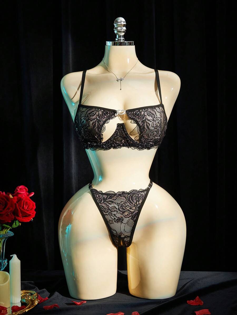Black lace lingerie set for women featuring underwire cup detail, adjustable spaghetti straps, hollow out backless design, and matching low-rise thong.