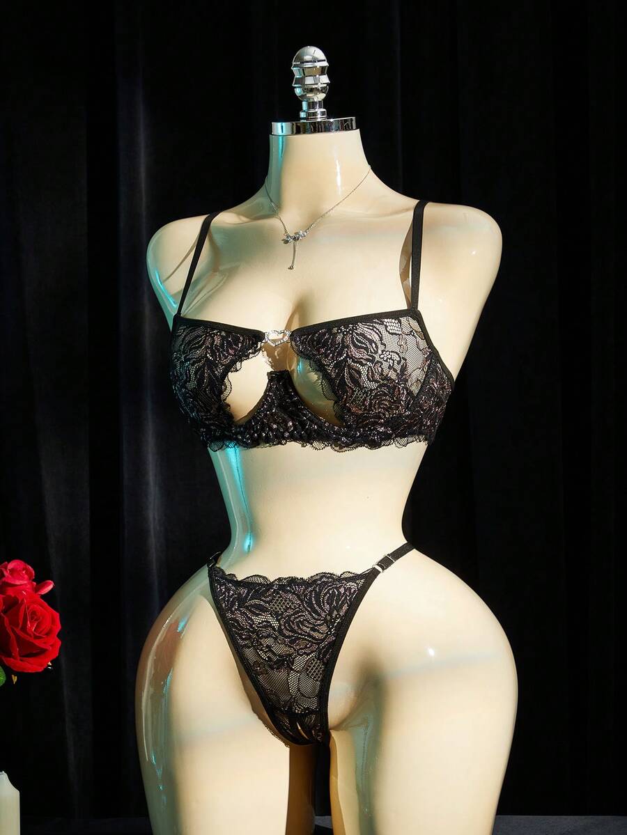 Black lace lingerie set for women featuring underwire cup detail, adjustable spaghetti straps, hollow out backless design, and matching low-rise thong.
