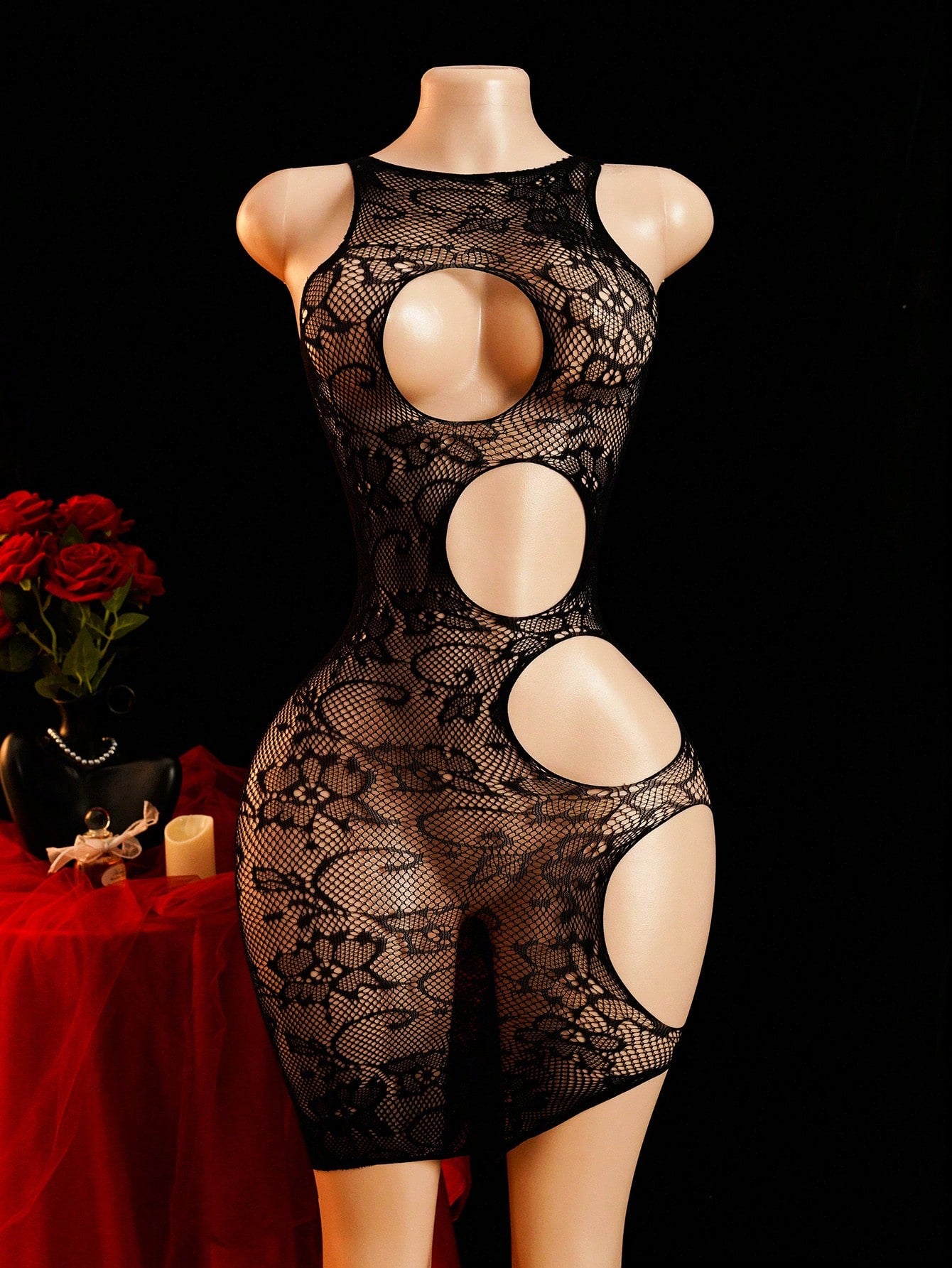 Women's sheer fishnet bodysuit dress with hollow out detail, round neck, plain pattern, and high-stretch black fabric.