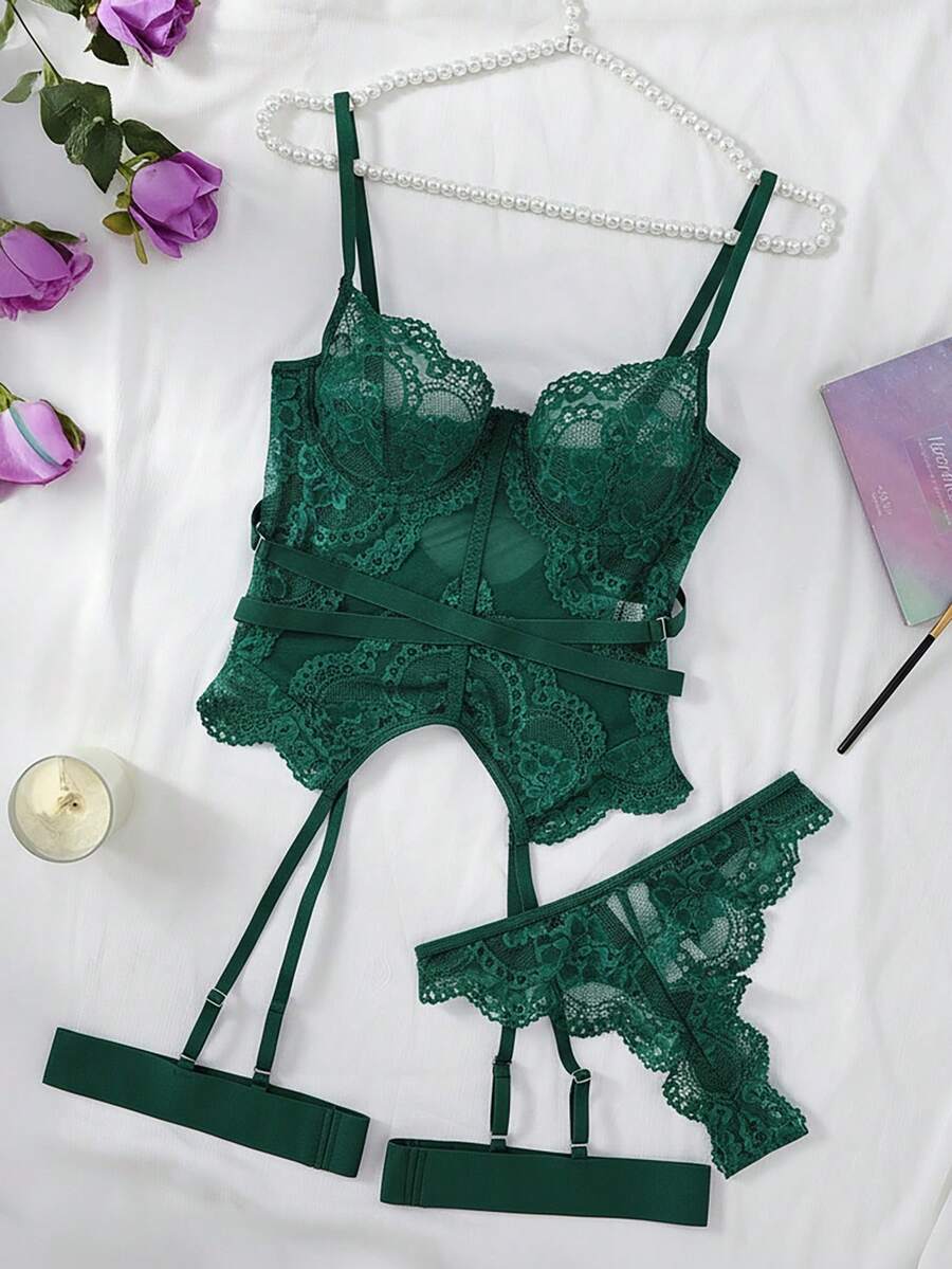 3-piece black lace lingerie set featuring a longline underwire 1/2 cup bra with adjustable spaghetti straps, cut out details, and matching low-rise thong