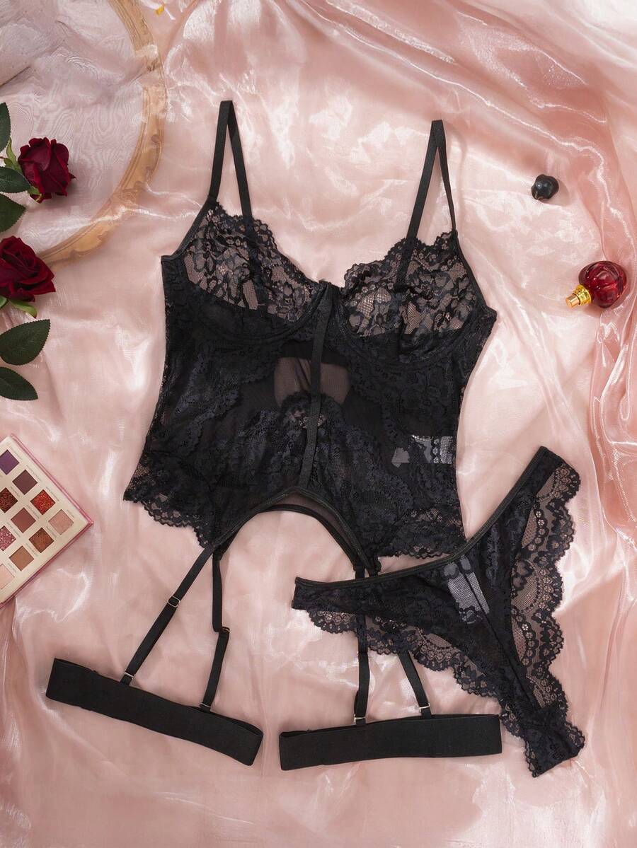 3-piece black lace lingerie set featuring a longline underwire 1/2 cup bra with adjustable spaghetti straps, cut out details, and matching low-rise thong