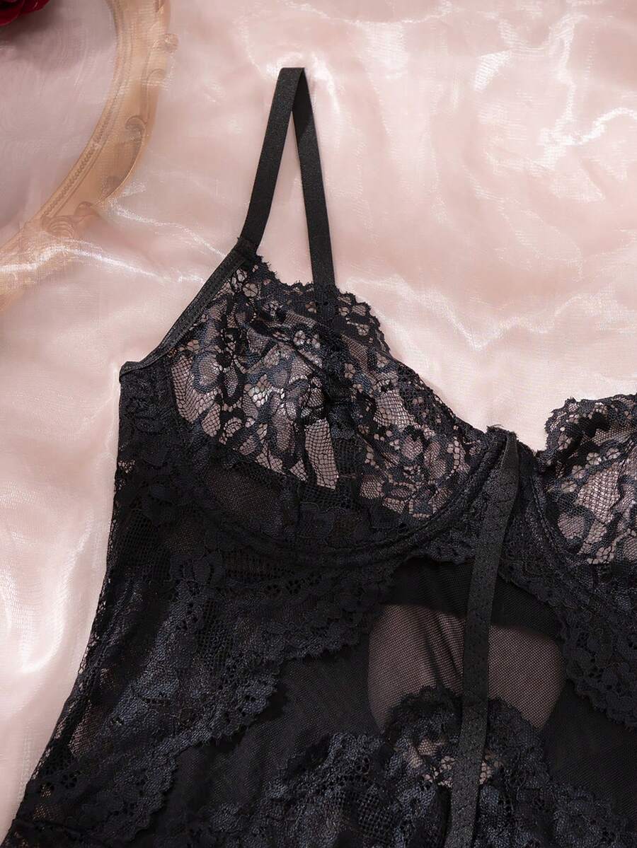 3-piece black lace lingerie set featuring a longline underwire 1/2 cup bra with adjustable spaghetti straps, cut out details, and matching low-rise thong