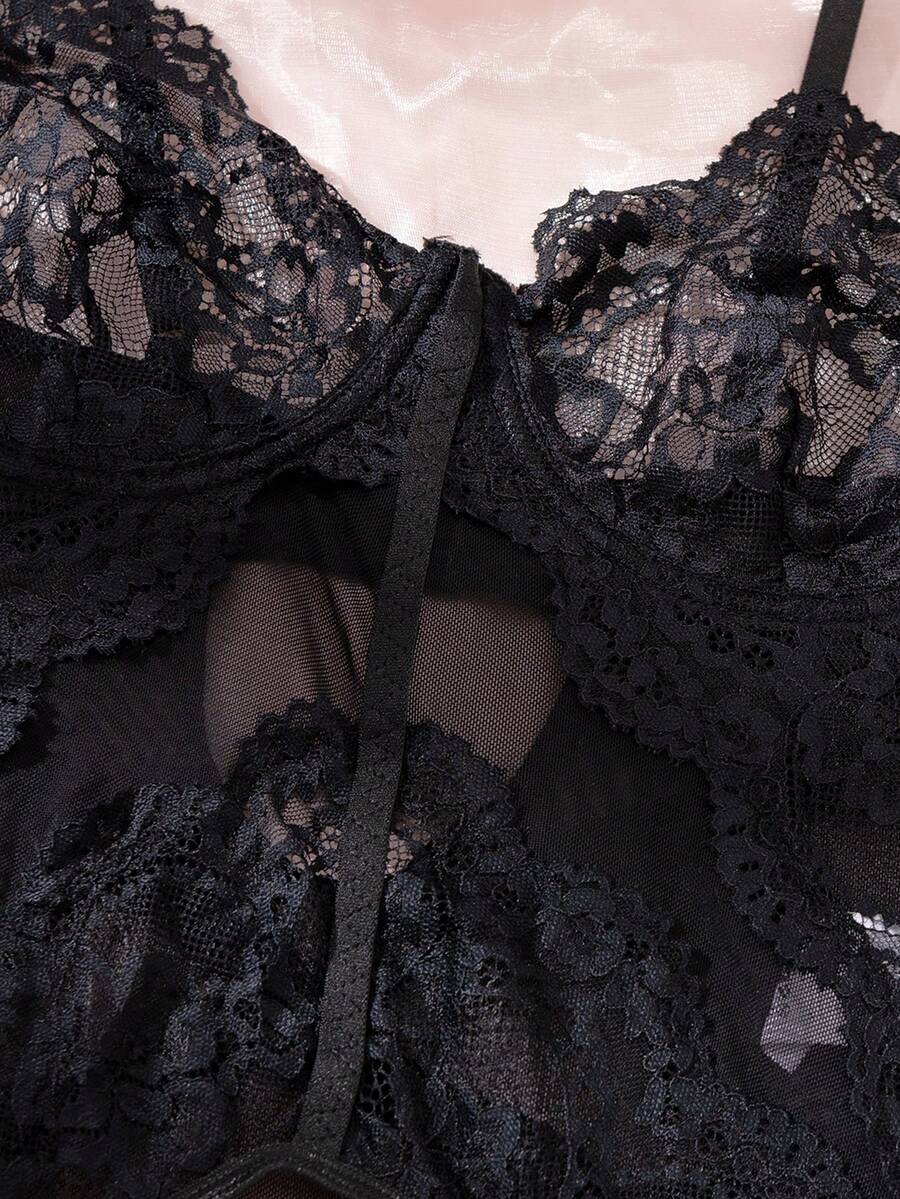 3-piece black lace lingerie set featuring a longline underwire 1/2 cup bra with adjustable spaghetti straps, cut out details, and matching low-rise thong