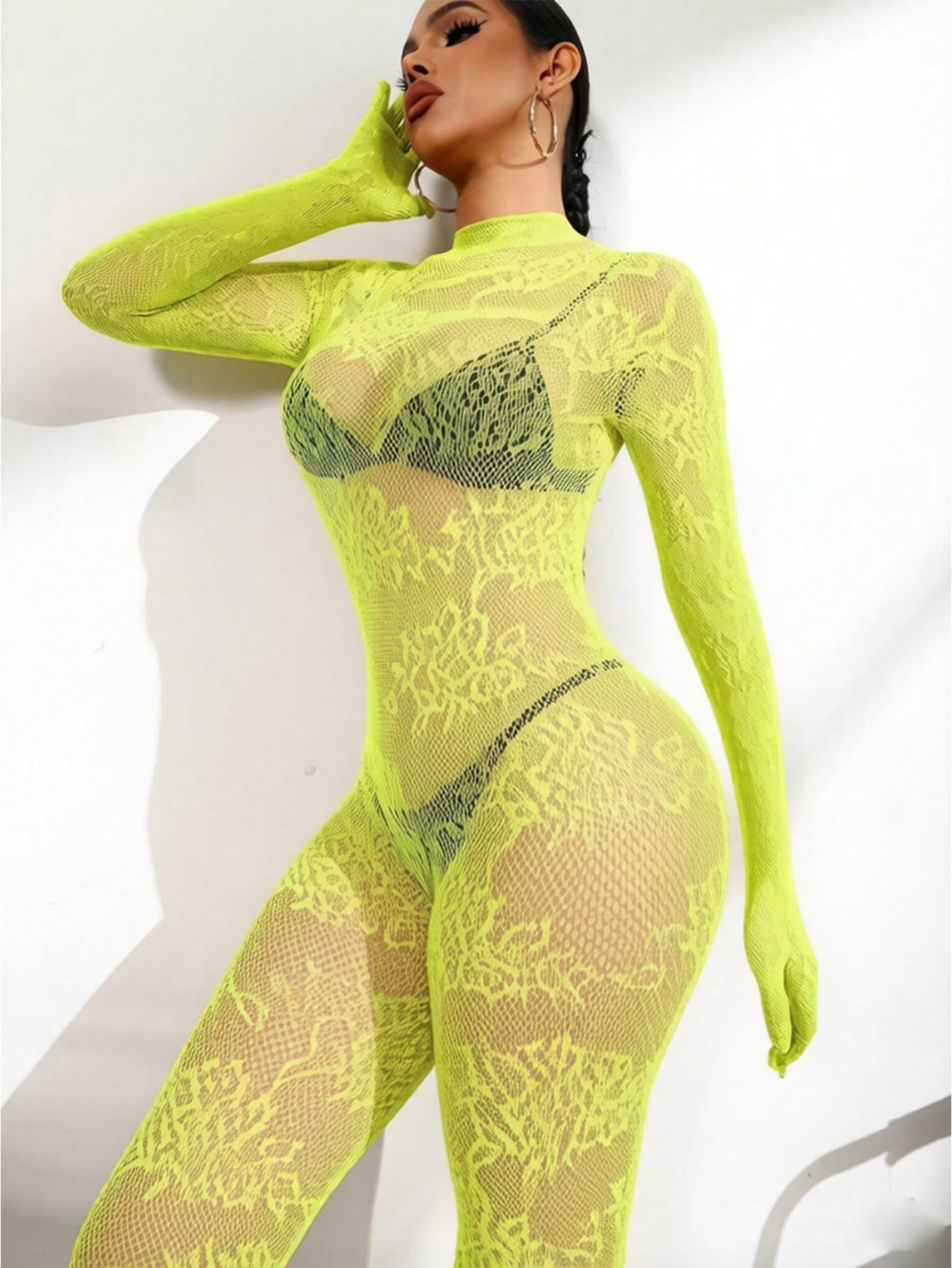 Women's sheer lingerie jumpsuit with contrast lace, cut-out details, long sleeves, stand collar, adjustable straps, and backless wireless design.
