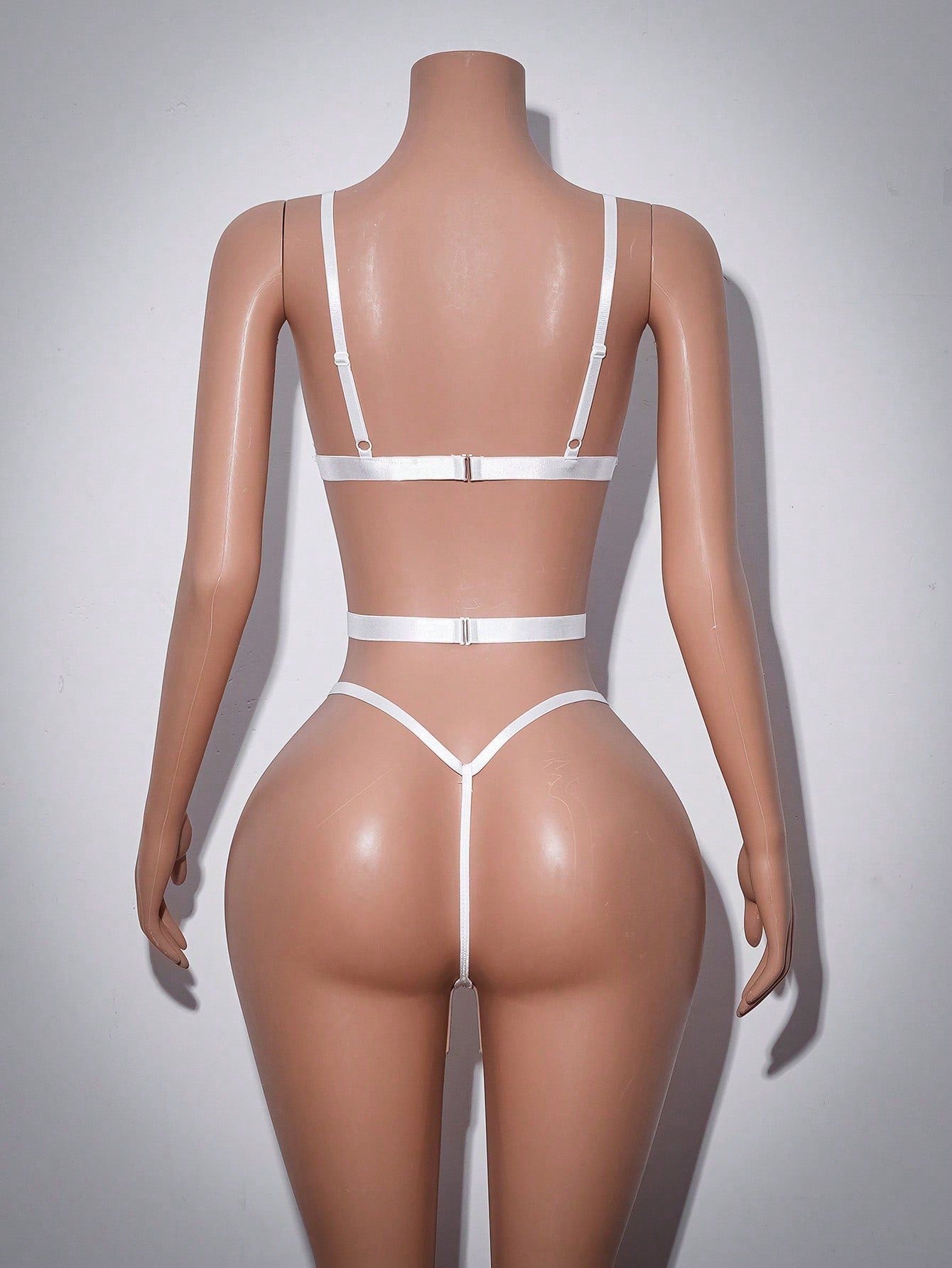 Women’s baby blue lace teddy bodysuit with sheer cut-out design, adjustable straps, V-neck, underwire triangle cups, and thong back.