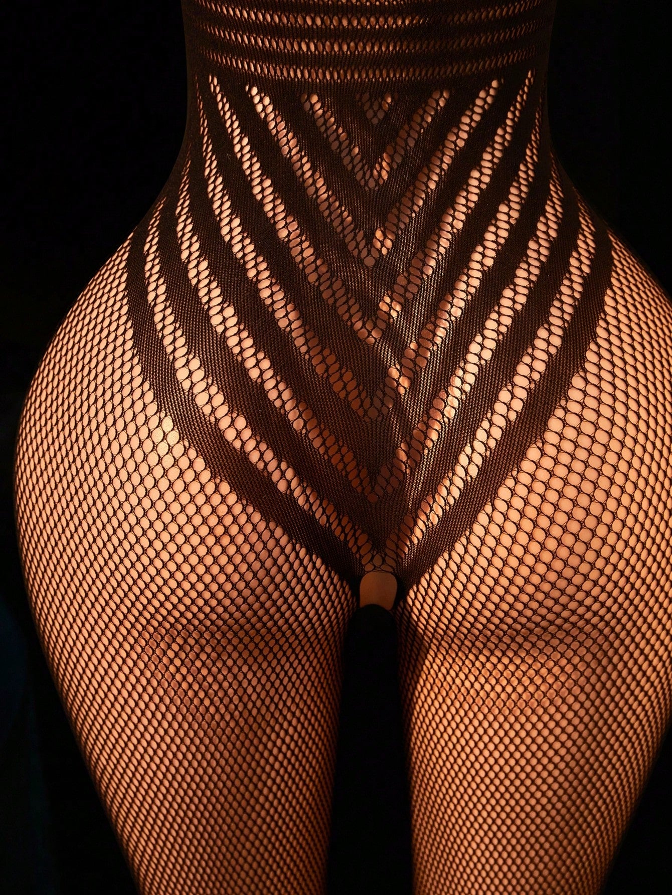 Women's fishnet bodystocking lingerie with halter neckline, backless hollow out detail, sleeveless design, and high-stretch fabric.