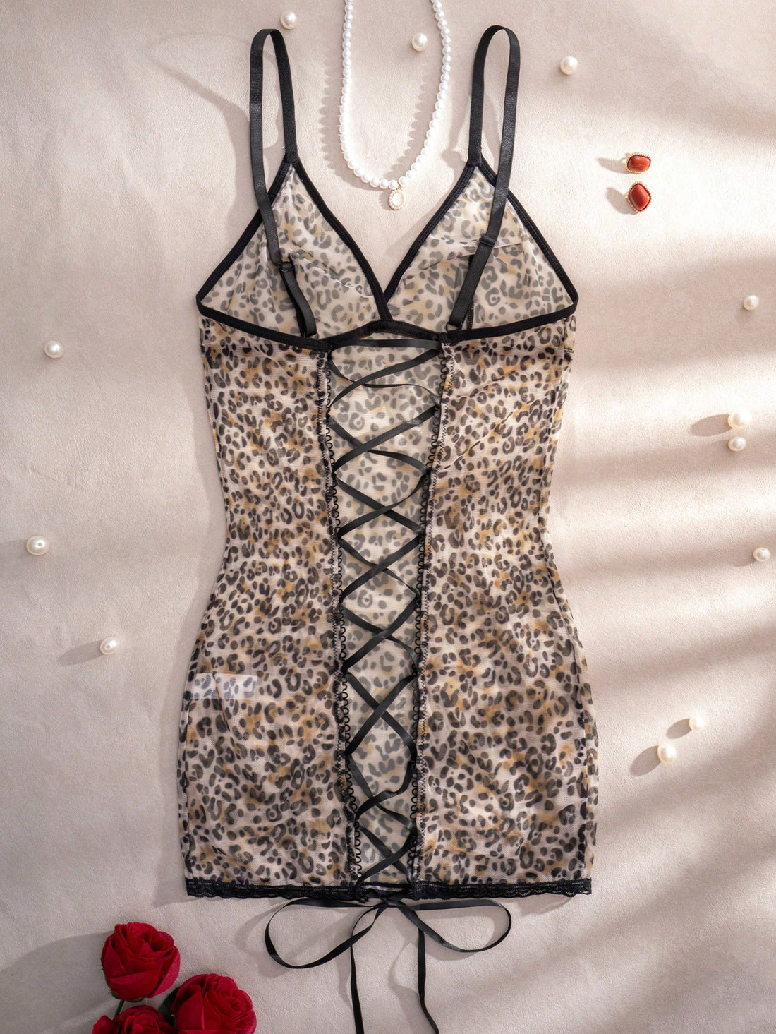 Women's leopard print semi-sheer mesh nightdress with backless tie-up design, criss cross cut out details, adjustable spaghetti straps, and wireless stretch fit.