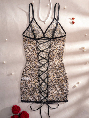 Women's leopard print semi-sheer mesh nightdress with backless tie-up design, criss cross cut out details, adjustable spaghetti straps, and wireless stretch fit.