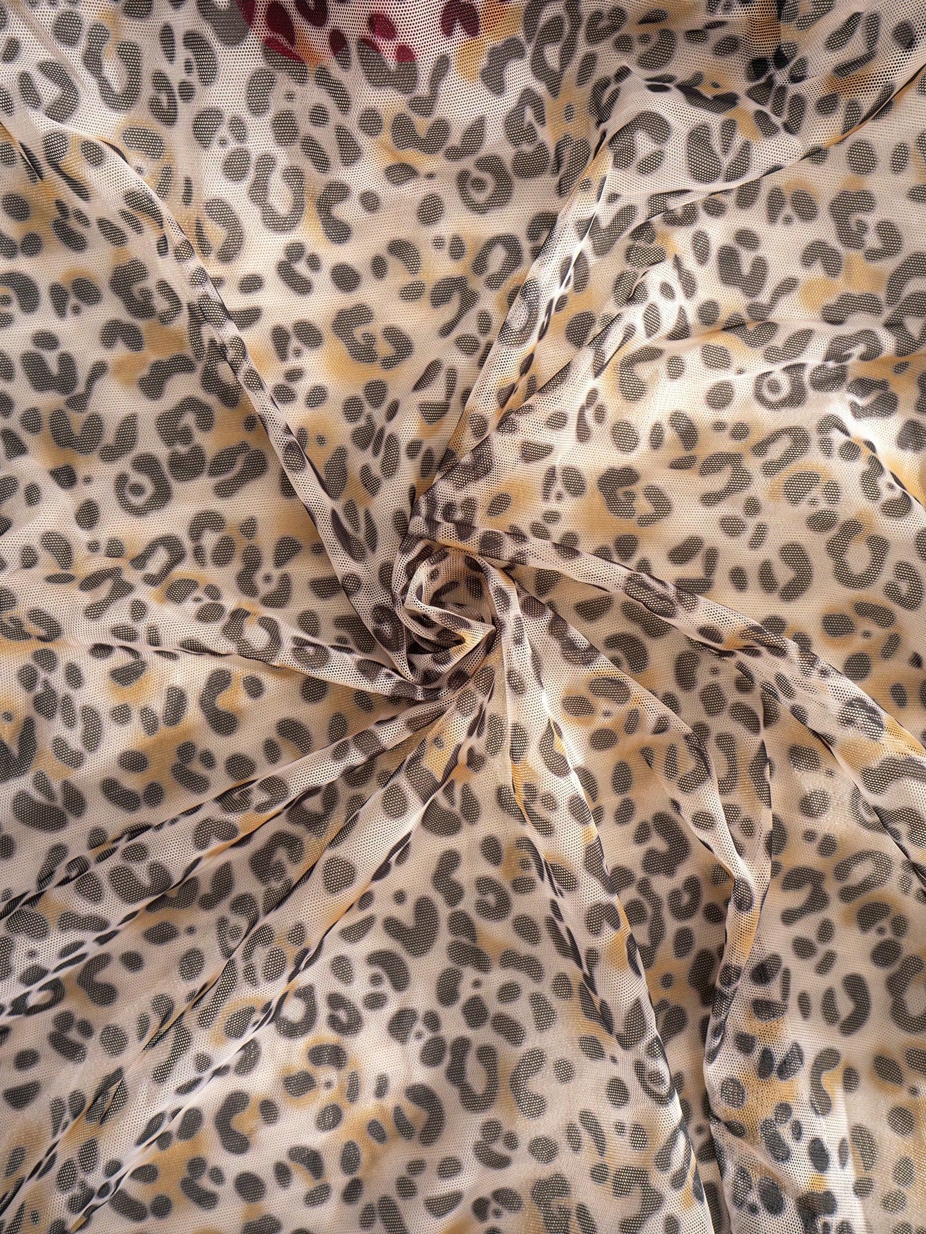 Women's leopard print semi-sheer mesh nightdress with backless tie-up design, criss cross cut out details, adjustable spaghetti straps, and wireless stretch fit.
