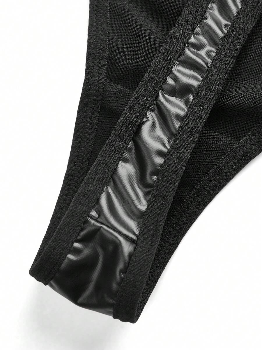 Set of 3 women's black mid-rise goth thongs featuring front embroidered butterfly design and PU leather patchwork details.