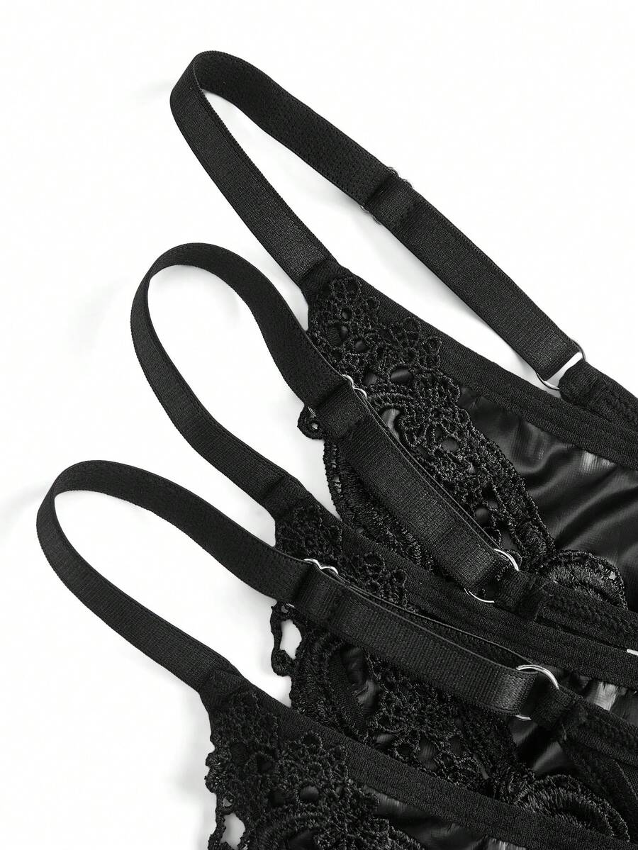 Set of 3 women's black mid-rise goth thongs featuring front embroidered butterfly design and PU leather patchwork details.