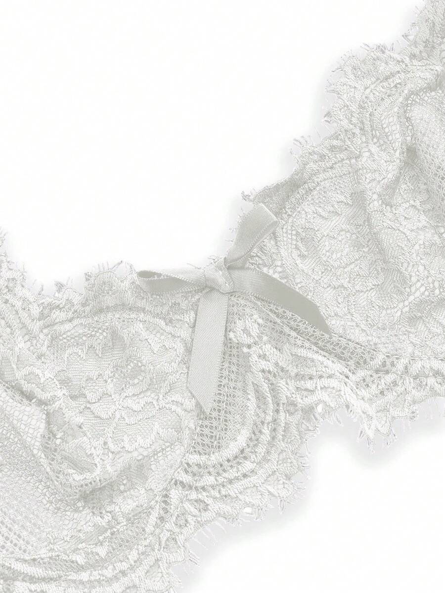 Black sheer floral lace plunge bra featuring underwire support, unlined triangle cups, adjustable straps, and a backless design for women.