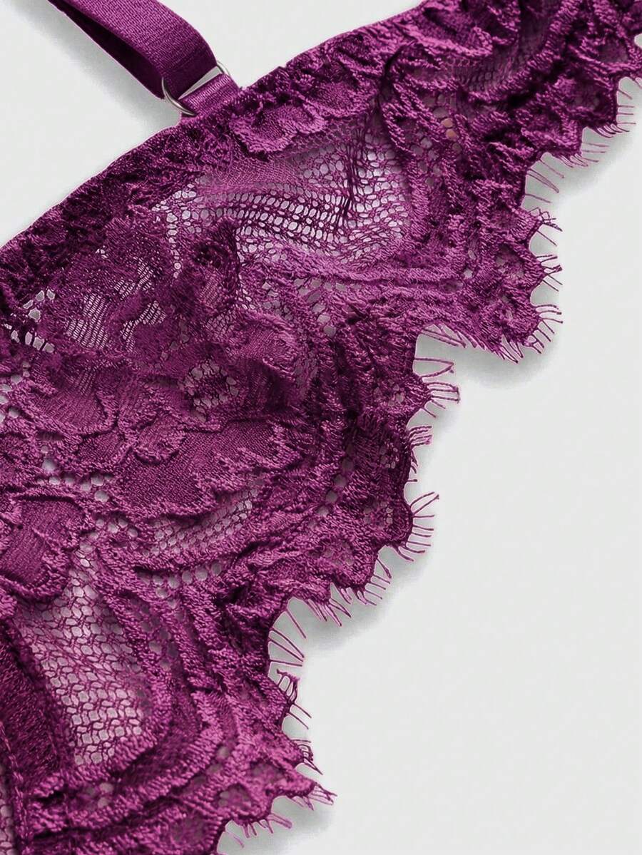 Black sheer floral lace plunge bra featuring underwire support, unlined triangle cups, adjustable straps, and a backless design for women.
