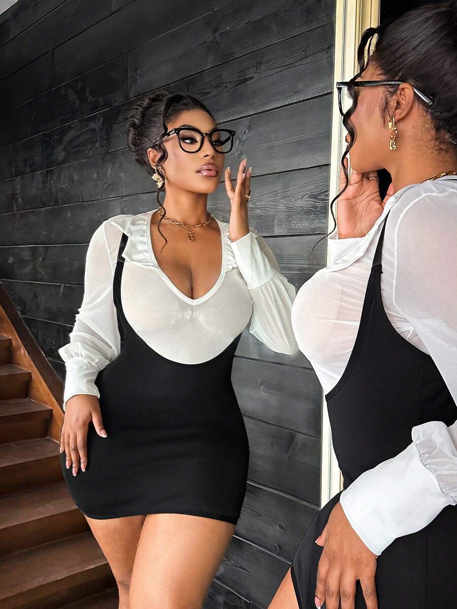 Black and white 2-piece office lady role play costume set featuring a deep V-neck long sleeve sheer mesh shirt with adjustable straps and wireless design.