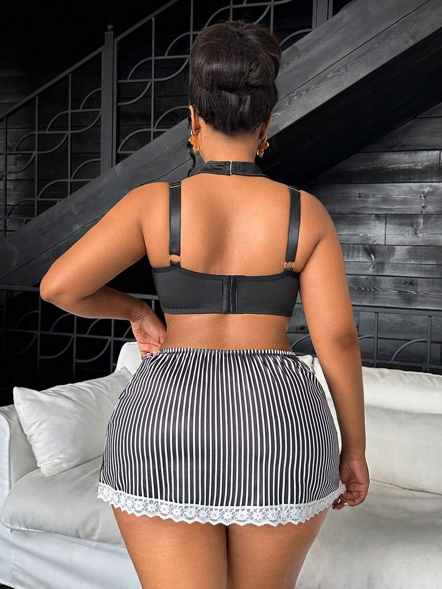 Black and white 3-piece role play lingerie set for women featuring a backless spaghetti strap top with contrast lace, underwire support, and a split short skirt.