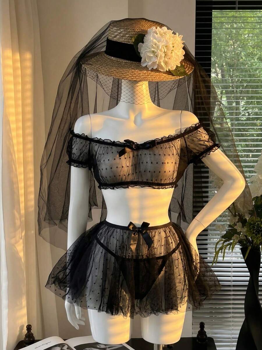 3-piece women's sheer mesh lingerie set featuring a wireless bralette with adjustable spaghetti straps, mini skirt with bow details, and matching low rise thong