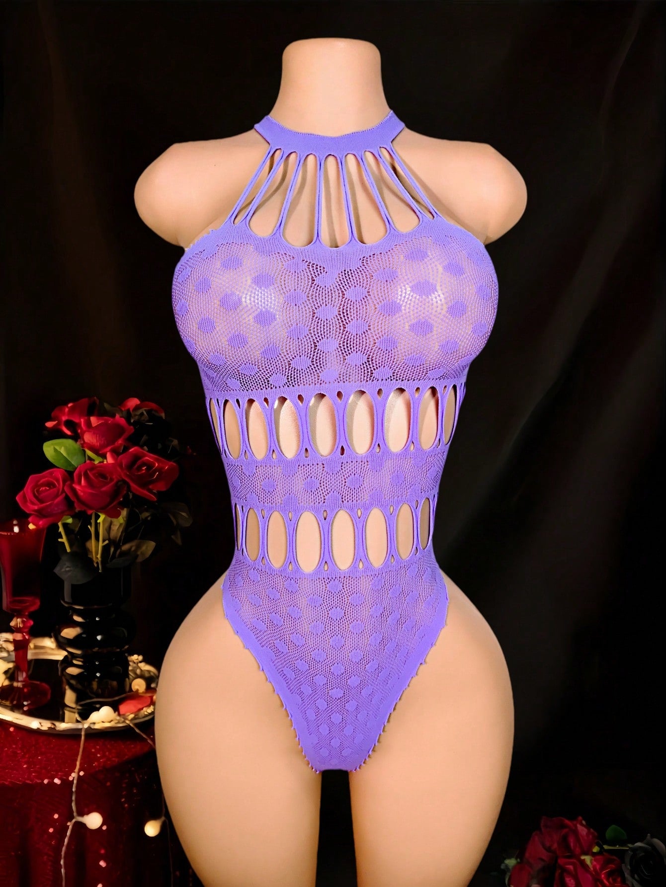 Women's fishnet sheer bodysuit with spaghetti straps, boat neckline, cut-out detail, sleeveless design, and high-stretch knitted fabric.