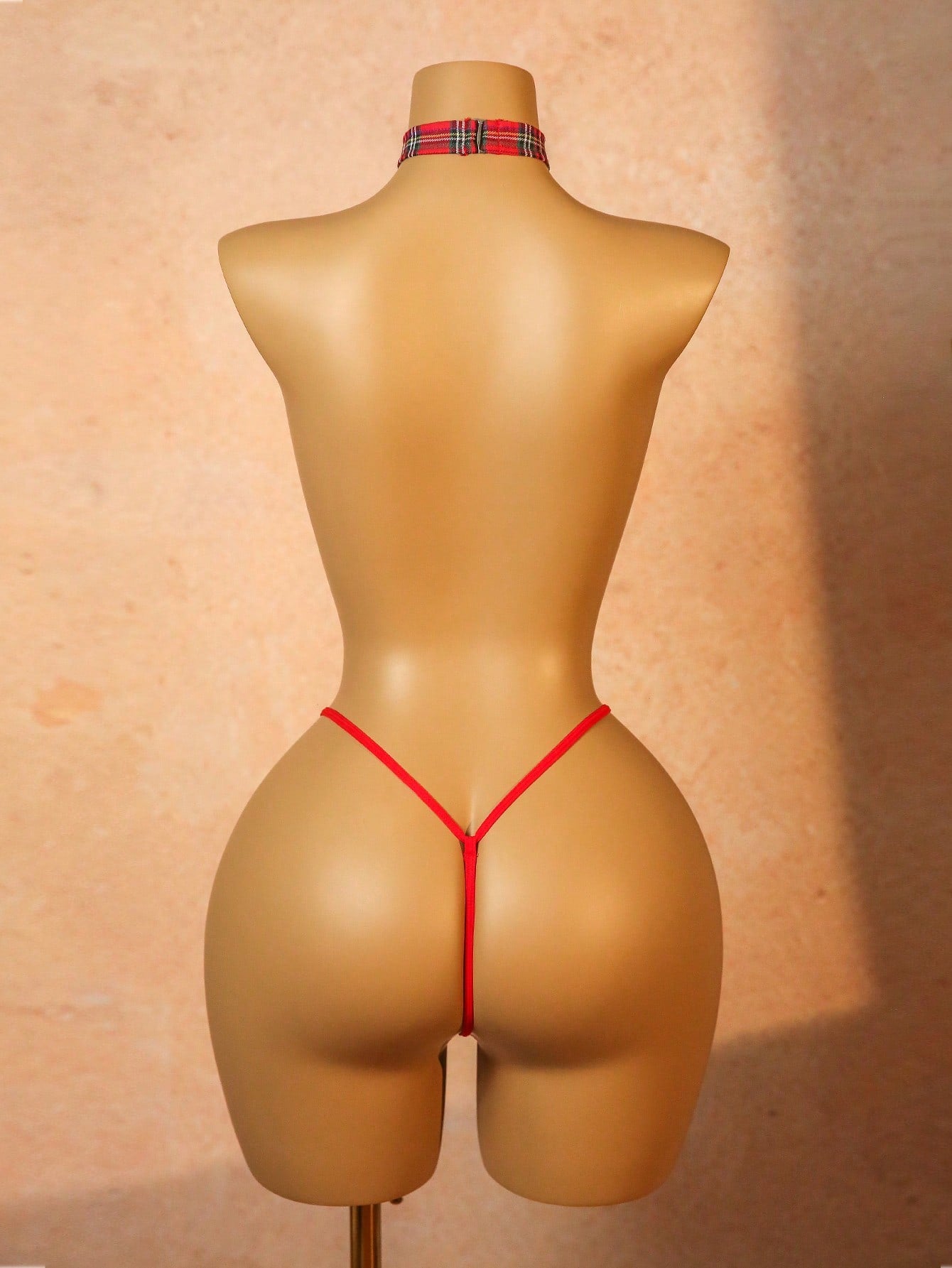 Women's red plaid 3-piece lingerie cosplay set with chest stickers, low-rise thong panties, and matching choker in polyester blend with adjustable straps and halter neckline.