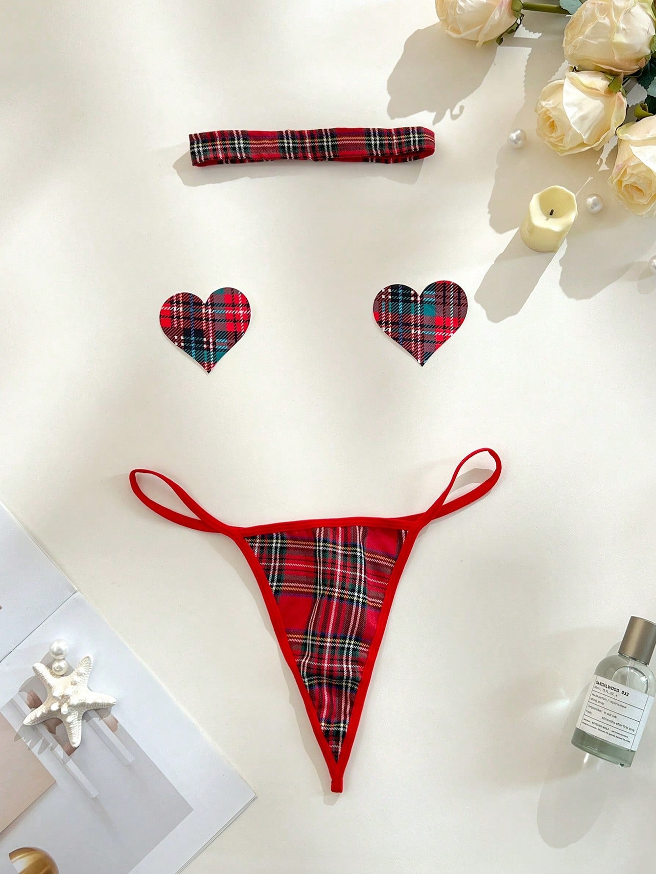 Women's red plaid 3-piece lingerie cosplay set with chest stickers, low-rise thong panties, and matching choker in polyester blend with adjustable straps and halter neckline.