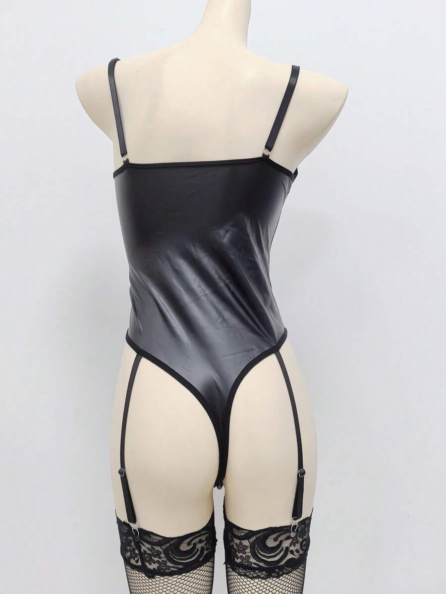Women's black lingerie bodysuit featuring contrast mesh, lace-up front, cut-out detailing, adjustable spaghetti straps, and low rise thong panty.