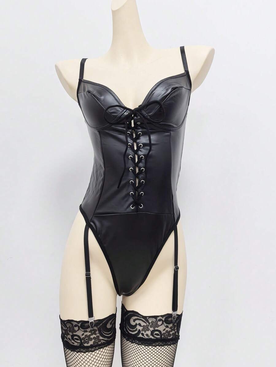 Women's black lingerie bodysuit featuring contrast mesh, lace-up front, cut-out detailing, adjustable spaghetti straps, and low rise thong panty.