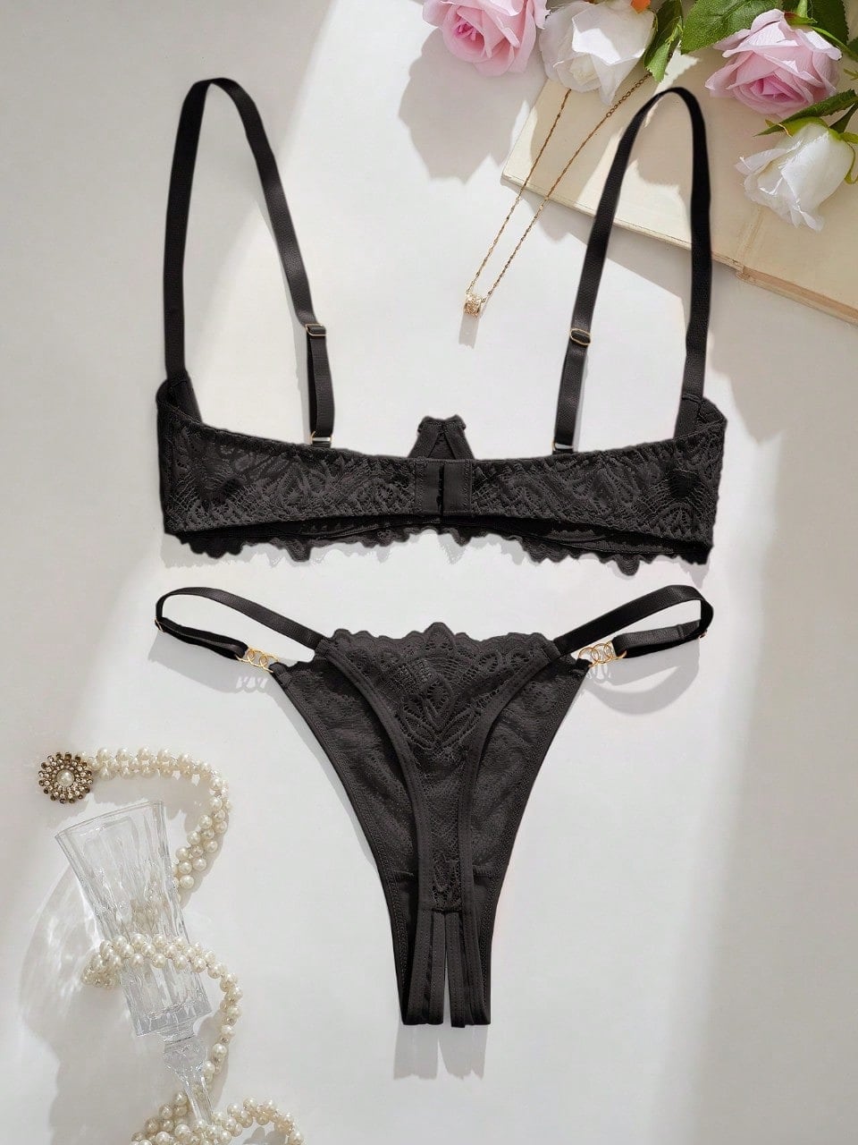 Women's lace bra and panty set with underwire bra, adjustable straps, 3/4 cup design, and matching thong panty in a sheer 2-piece lingerie style.