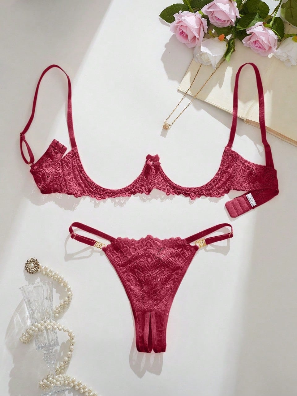 Women's lace bra and panty set with underwire bra, adjustable straps, 3/4 cup design, and matching thong panty in a sheer 2-piece lingerie style.