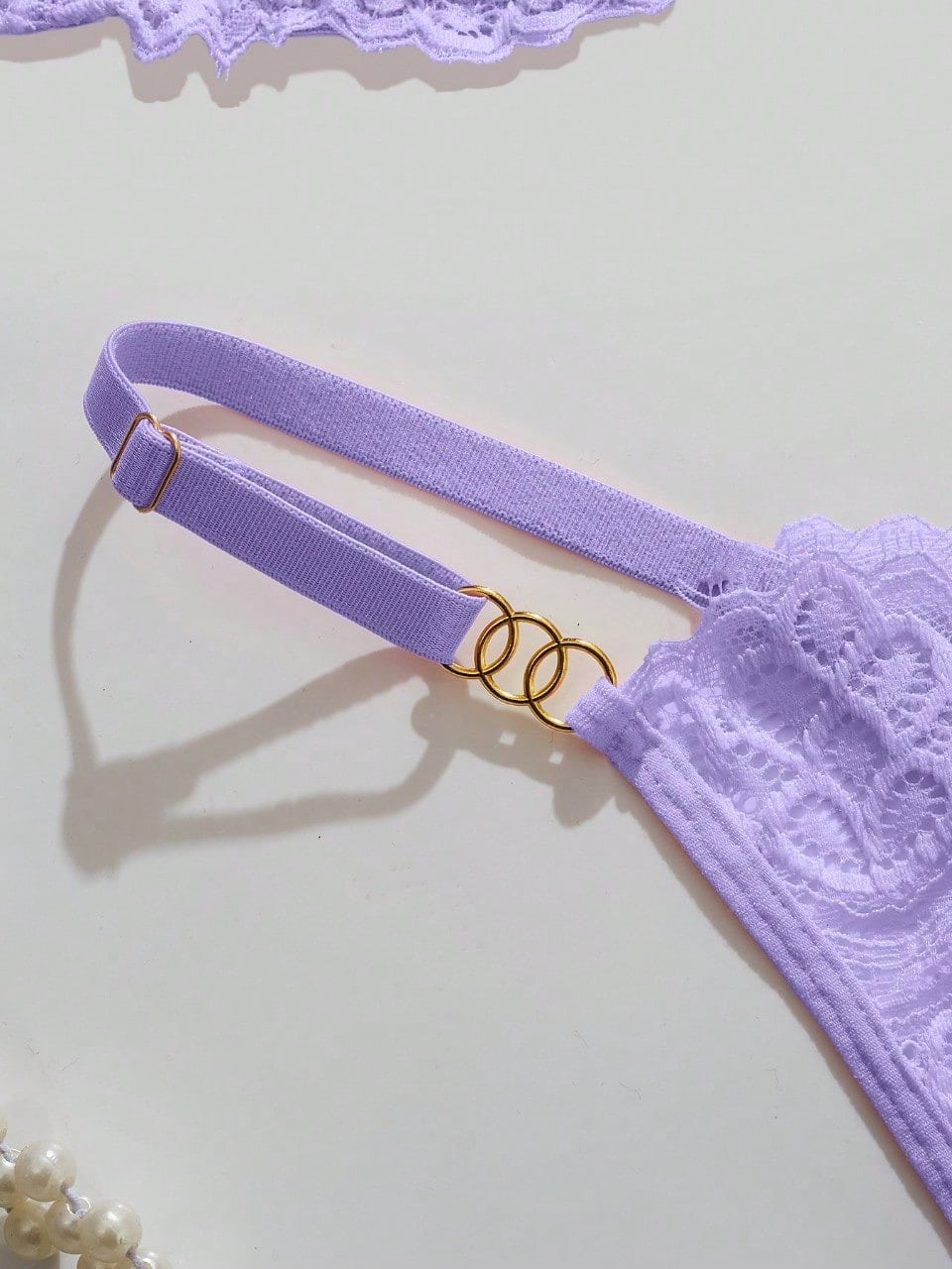 Women's lace bra and panty set with underwire bra, adjustable straps, 3/4 cup design, and matching thong panty in a sheer 2-piece lingerie style.